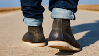 image-of-person-walking-away-wearing-boots