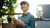 woman-smiling-at-a-text-message
