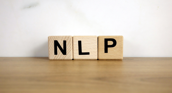 NLP natural language processing abbreviation on wooden blocks