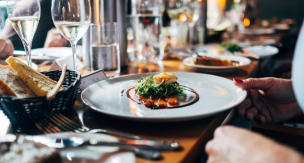 Person eating at a fine dining restaurant