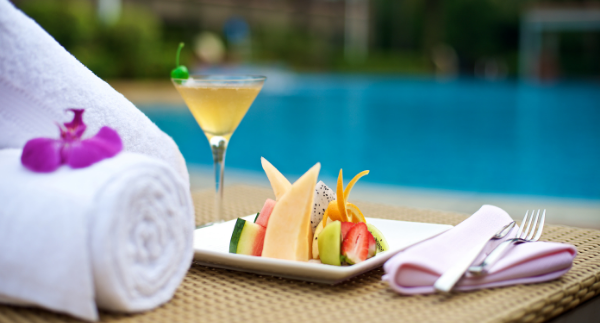 Fruit platter on sun lounger by hotel pool