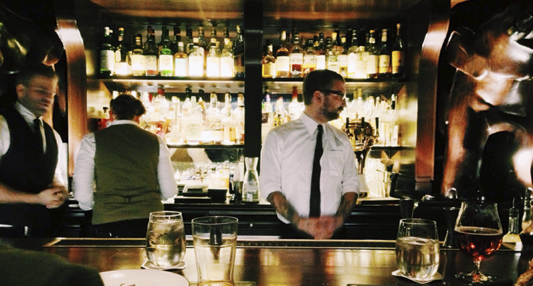 hotel bartender serving drinks